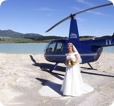 The bride beside the helicopter